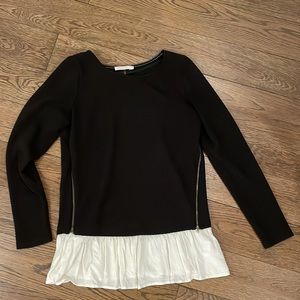 Black sweater with cream ruffle and zipper detailing